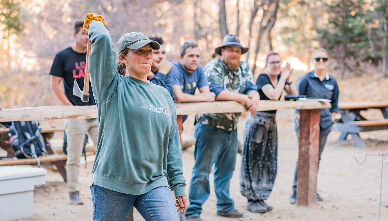A woman throwing a tomahawk.