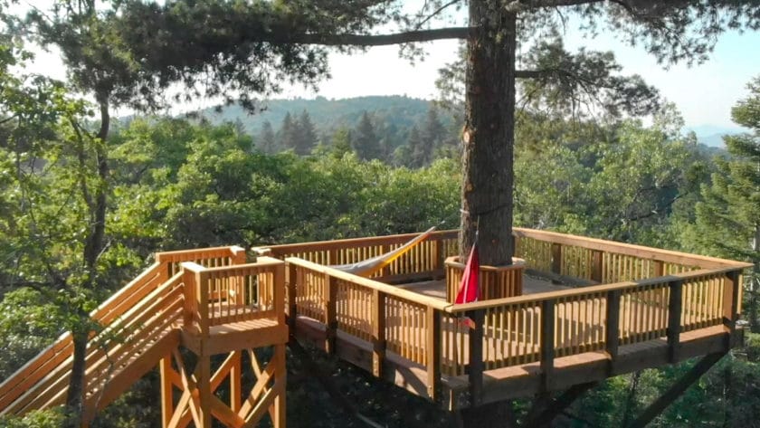 A balcony with hammocks.