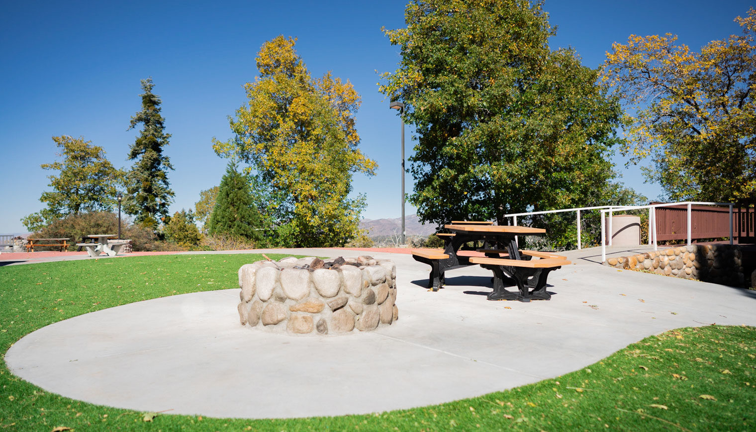 A fire pit and bench at the Overlook.